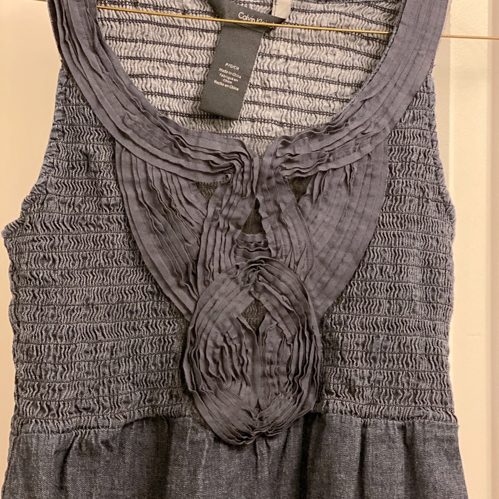 Denim dress by Calvin Klein. Slip over your head and go! Cute detailing - size S